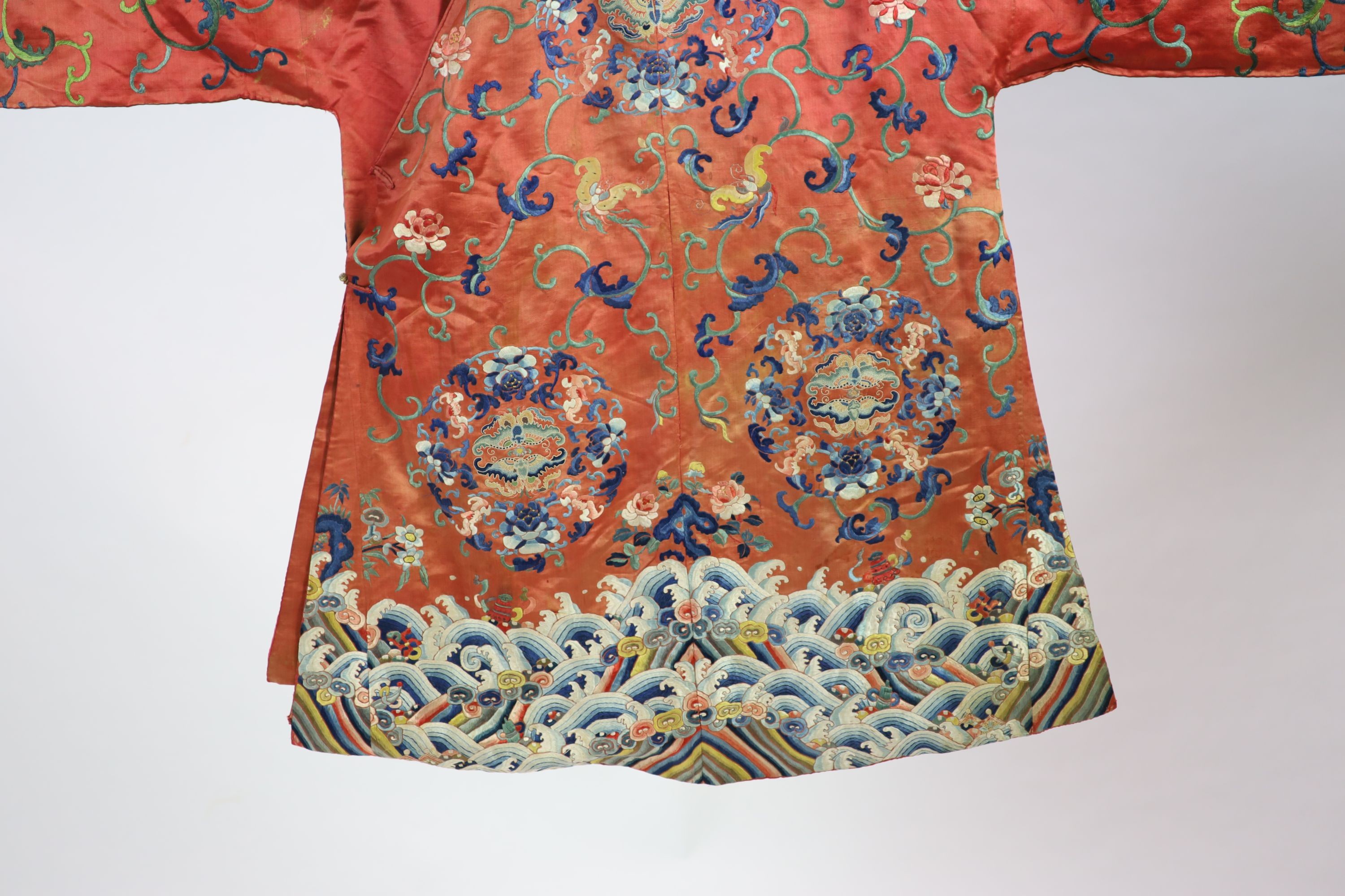 A Chinese apricot silk robe, mid 19th century, 125 cm long, wear to back of collar